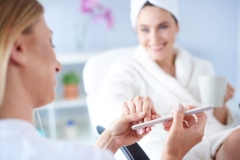 woman-salon-getting-her-manicure_329181-188261